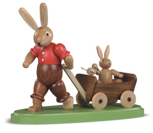 Easter bunny, male, with child on wooden handcart